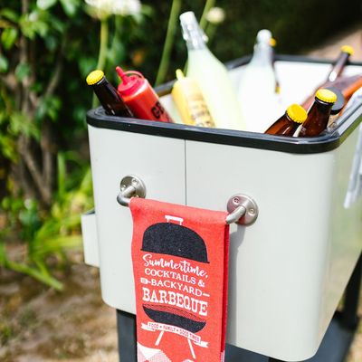 A bottle of water next to a towel.